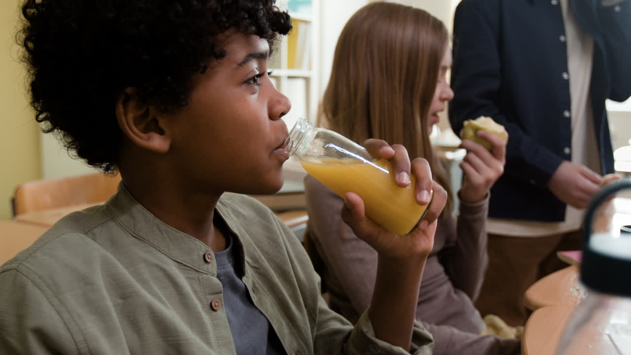 Students having a snack or lunch break in the classroom
