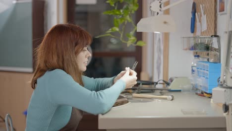 woman jewelry maker at work