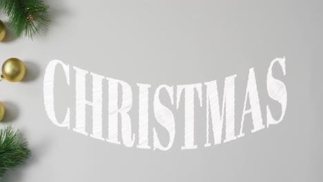 animation of christmas text over christmas decorations