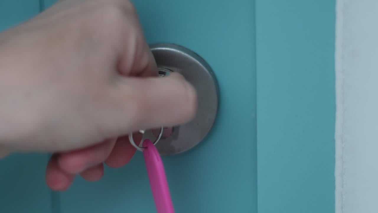 Female Opening and Unlocking Door Before Entering Home. Security concept