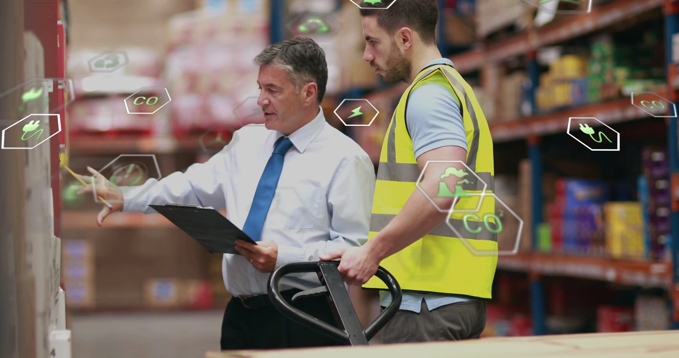 Manager pointing clipboard guiding worker at pallet jack while hex icons tracking warehouse stock