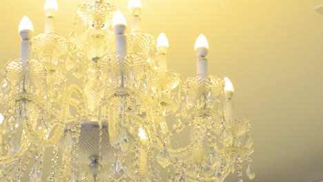 Chrystal-chandelier-lamp-on-the-ceiling-in-dining-room