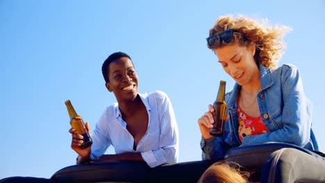 female friends having beer in the car 4k