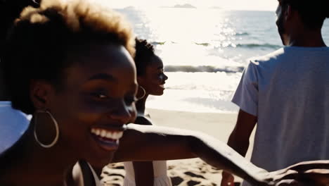 young friends enjoying a sunny day at the beach