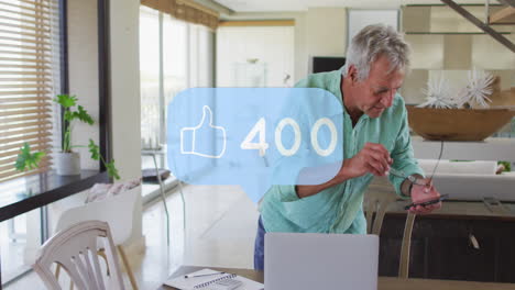 animation of social media thumbs up icon with numbers over senior man using smartphone