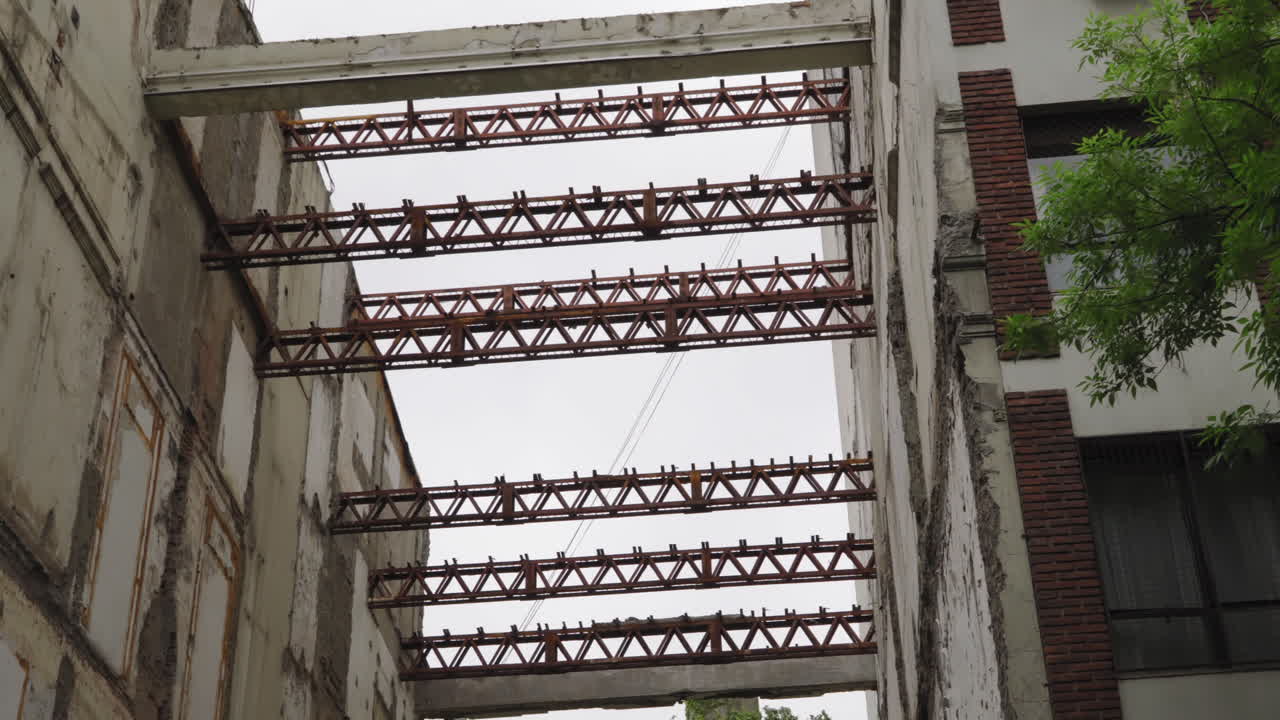 Rusty Metal Beams Supporting Damaged Building