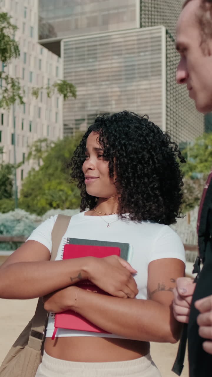 Millennial group of happy students, boys and girls with backpacks, books,