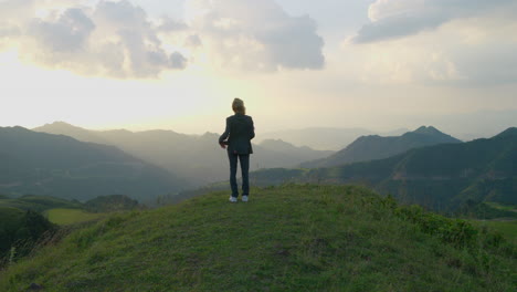 Slow-motion-shot-of-a-woman-holding-a-mid-autumn-festival-prop-overlooking-mountains