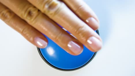 woman turning on wi-fi by pushing a blue shiny button. concept of fast wireless network connection. using free internet in wi-fi zone. button with a wave signal icon. hotspot interface, secure network