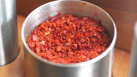 red pepper flakes in a metal container