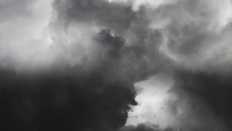 lightning strike in a thunderstorm between thick clouds