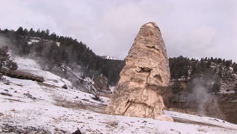 tilt shot of a limestone cone created by mineral deposits in yellowstone national park