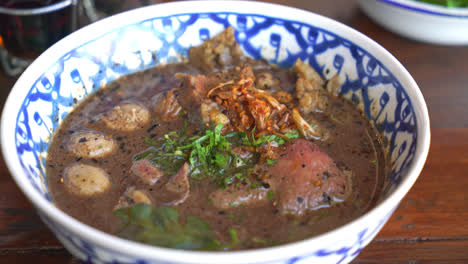 thai boat noodles with wagyu - thai noodle with beef in blood soup