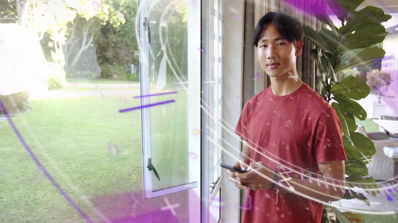 Teen at window glancing to phone and tapping, reading, purple tech streaks overlapping subject