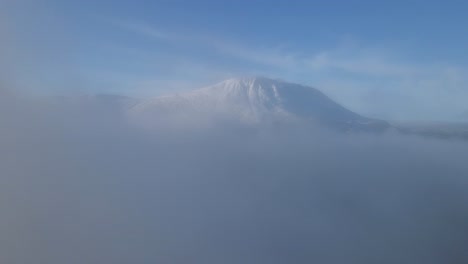 White-mountain-disappearing-in-clouds