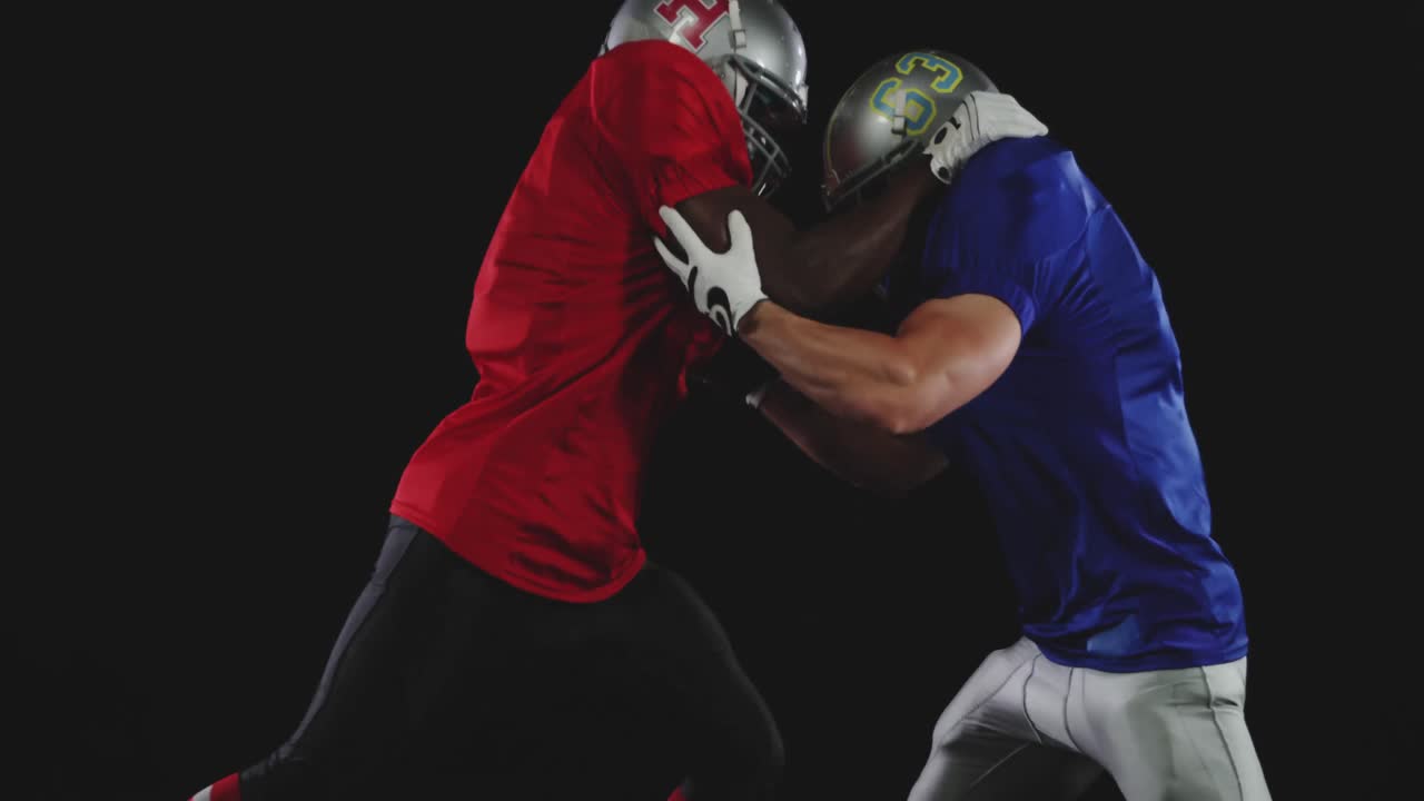 Two American football players in action