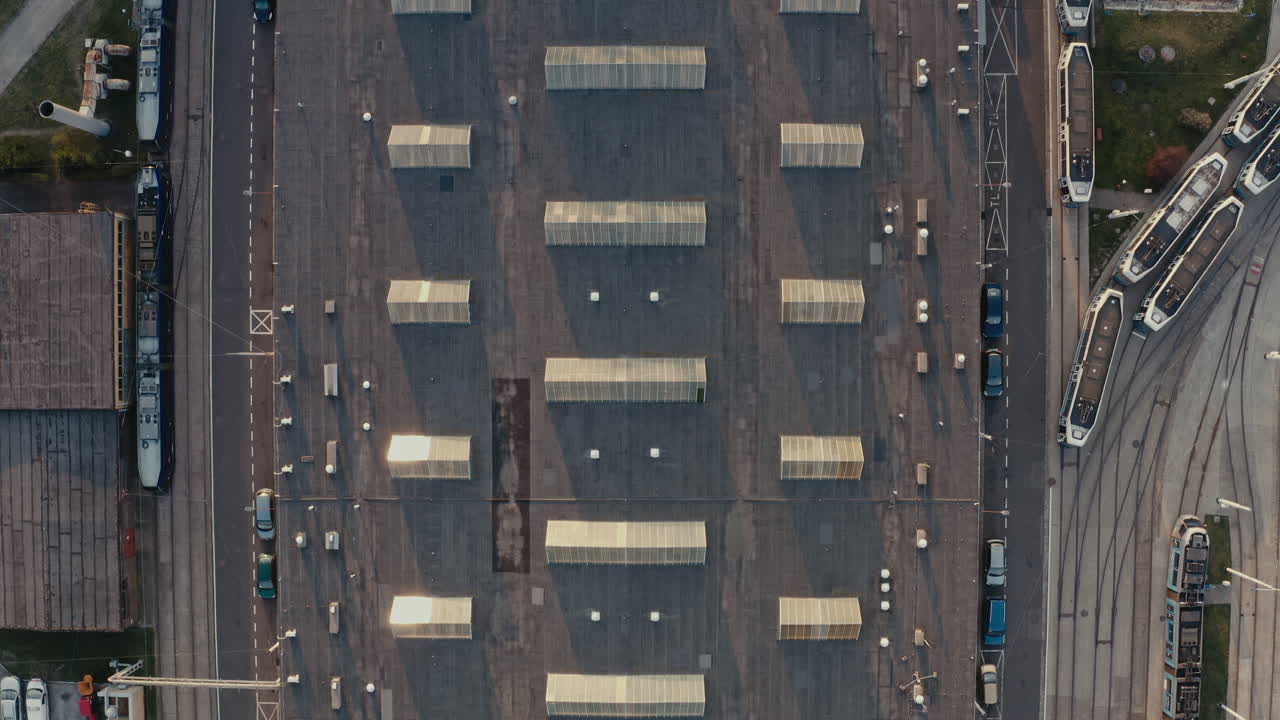 Aerial View of an Industrial Complex with Trains and Parking