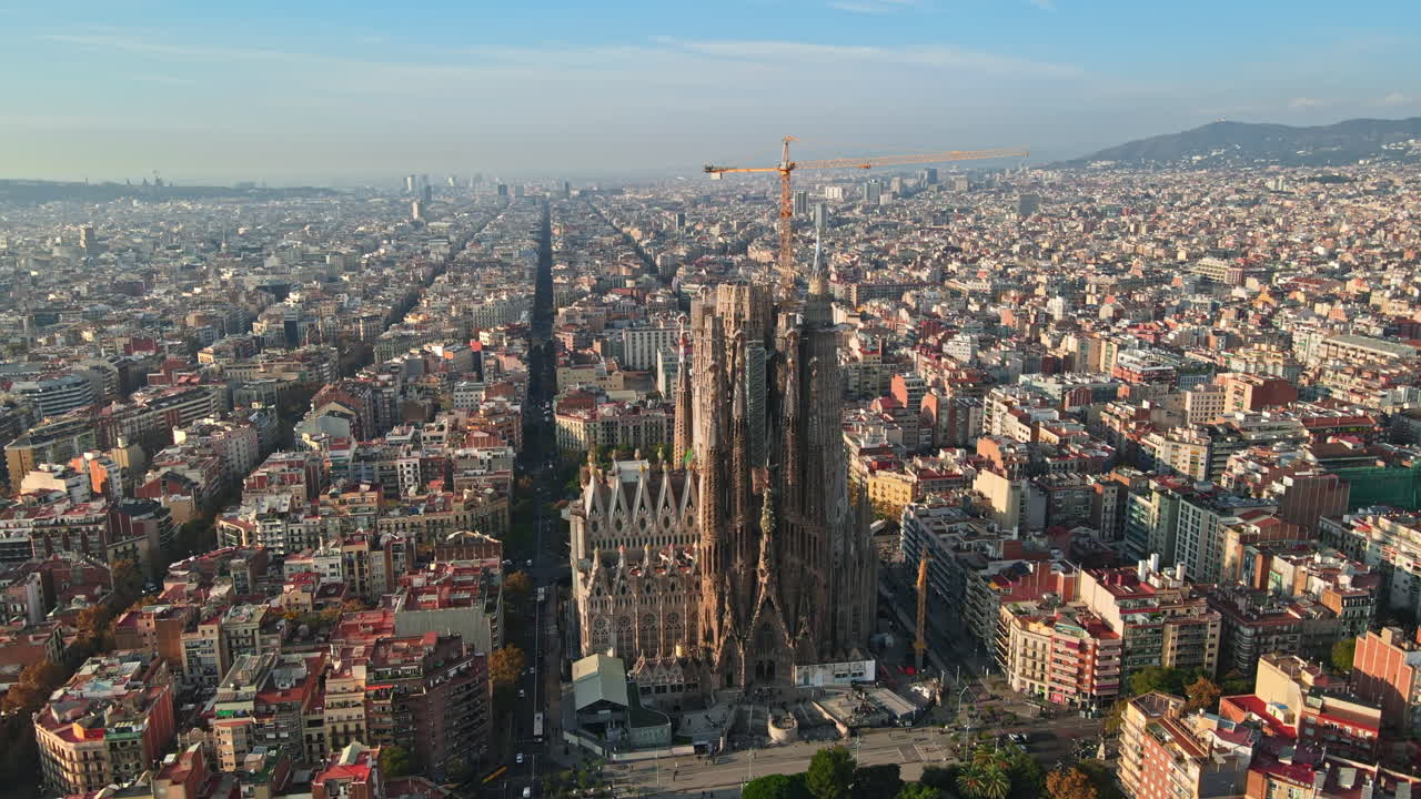 Aerial drone view of Barcelona, Spain. Blocks with multiple residential buildings and Sagrada Familia