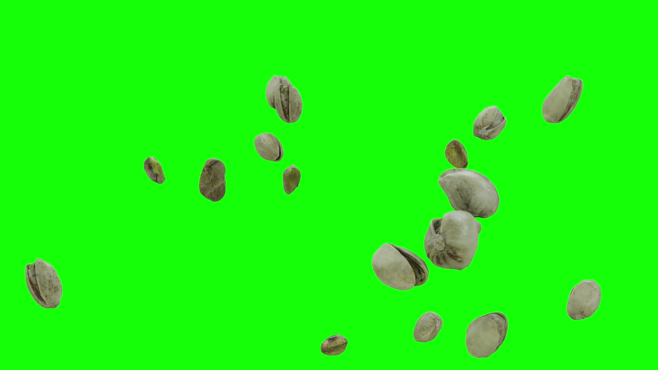Pistachios Falling on Green Screen Background With Alpha Matte