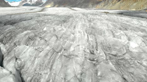 flying above aletsch glacier valley under swiss alps