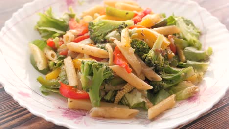 delicious vegetarian penne pasta salad with broccoli and bell peppers