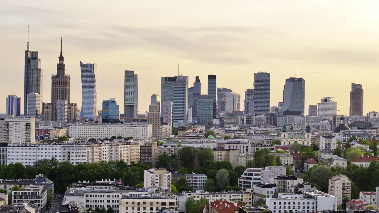 Warsaw Skyline With Varso Place And Palace of Culture and Science Building At Sunset In Poland. - aerial shot
