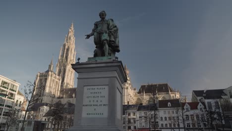 statue of rubens in antwerp with cathedral in the background