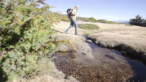 male-explorer-trekker-backpacking-alone-high-mountain-trail-exploring-penalara-natural-park-in-Madrid-Spain