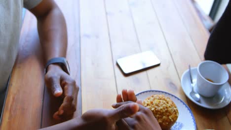 couple holding hand in cafe 4k