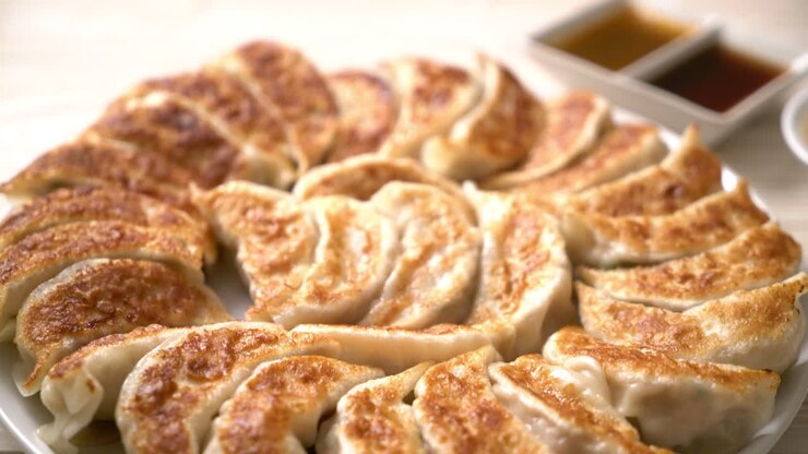 fried gyoza or dumplings snack with soy sauce in Japanese style