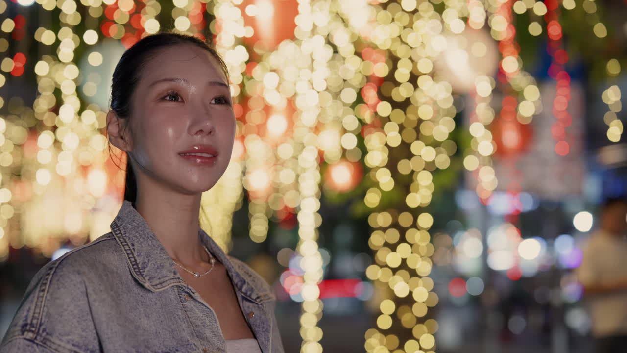 Woman at night with city lights