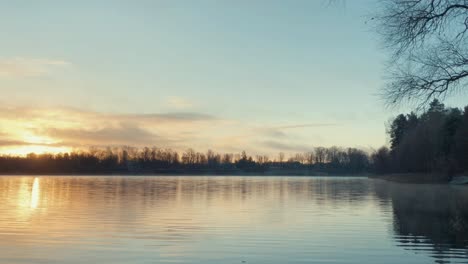 Sunrise-over-the-lake-near-the-shore,-timelapse,-4k