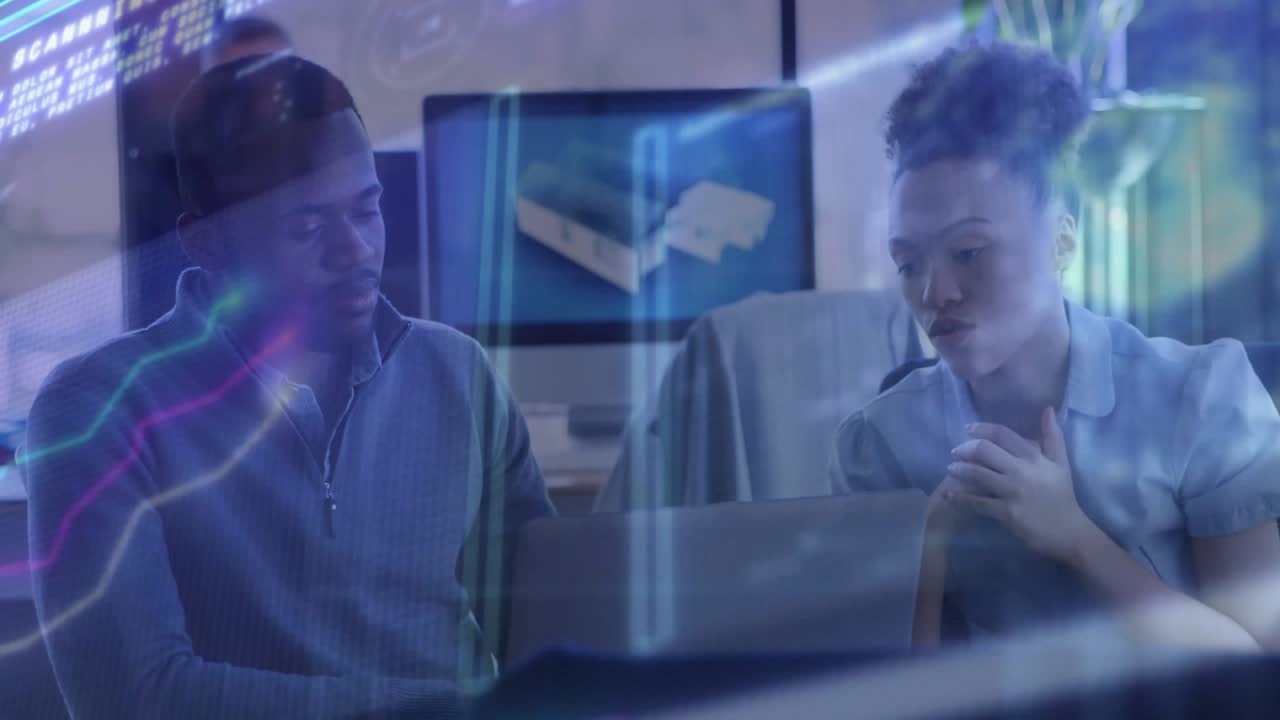 Vertical video: Right woman pointing at laptop starting biz review overlays over team both looking