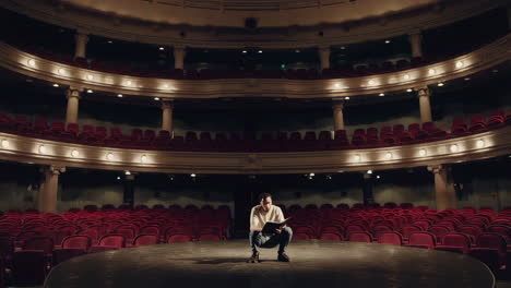 actor reading script on stage