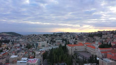 Aerial-footage-of-the-Basilica-of-the-Annunciation-over-the-old-city-houses-of-Nazareth