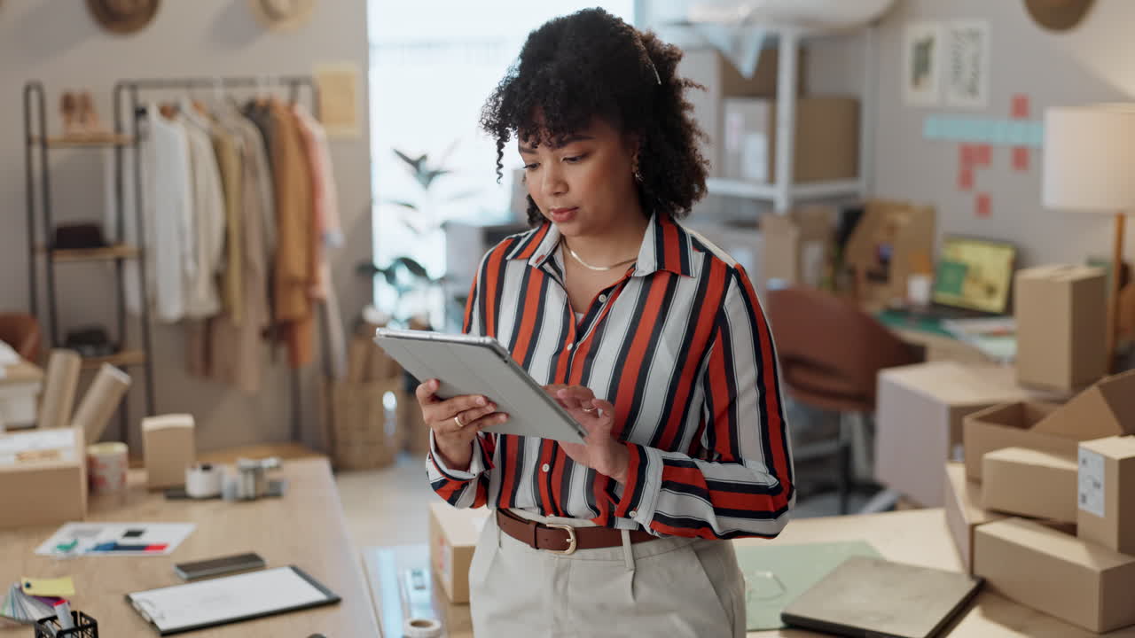 Happy woman, tablet and boxes in small business