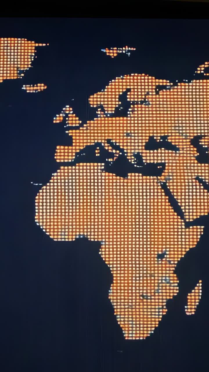 Vertical video: Displaying world map on LED screen in control room, dots shifting white to orange