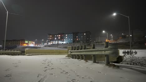 snow storm at night covering small canadian town