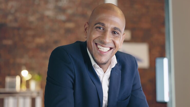 Business man, face and smile at computer in office