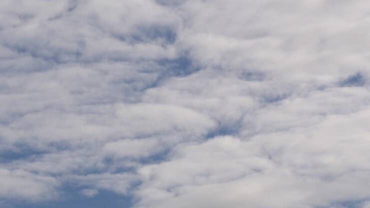An immense blue sky with a lot of clouds that move at turtle speed