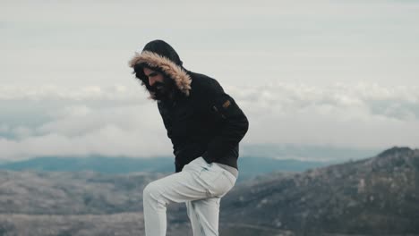 an inspired man with a mustache takes a scenic walk through a breathtaking mountain landscape