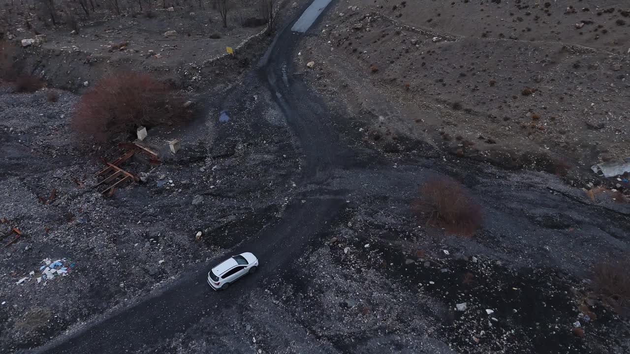 Aerial view of a damaged mountain road and valley