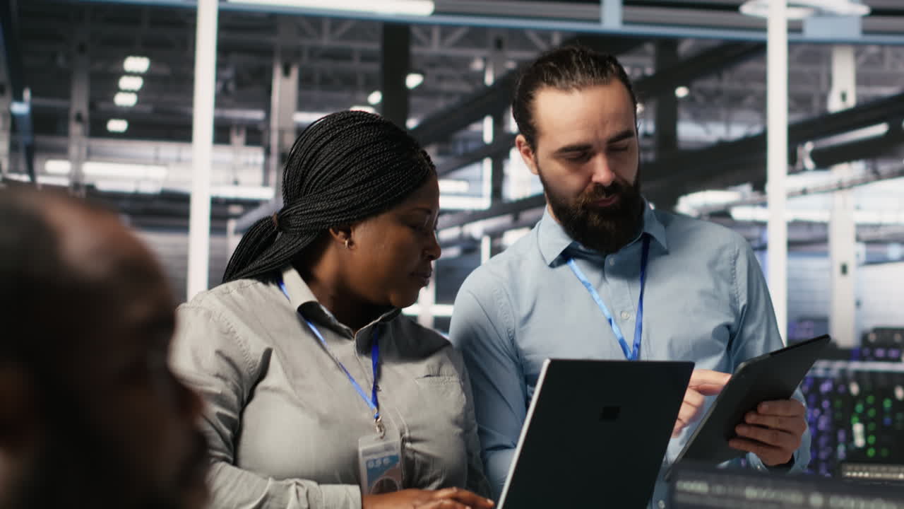 Vertical video Server hub supervisor overseeing computer scientists improving neural network
