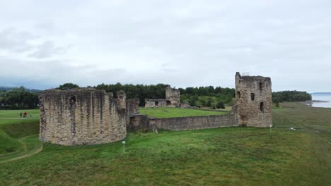 Flint-castle-Welsh-medieval-coastal-military-fortress-ruin-aerial-view-slow-right-rising-shot