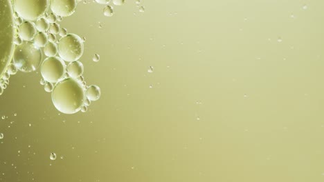 animation of bubbles moving on yellow background with copy space