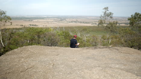 man looking out from the you yangs national park, victoria australia