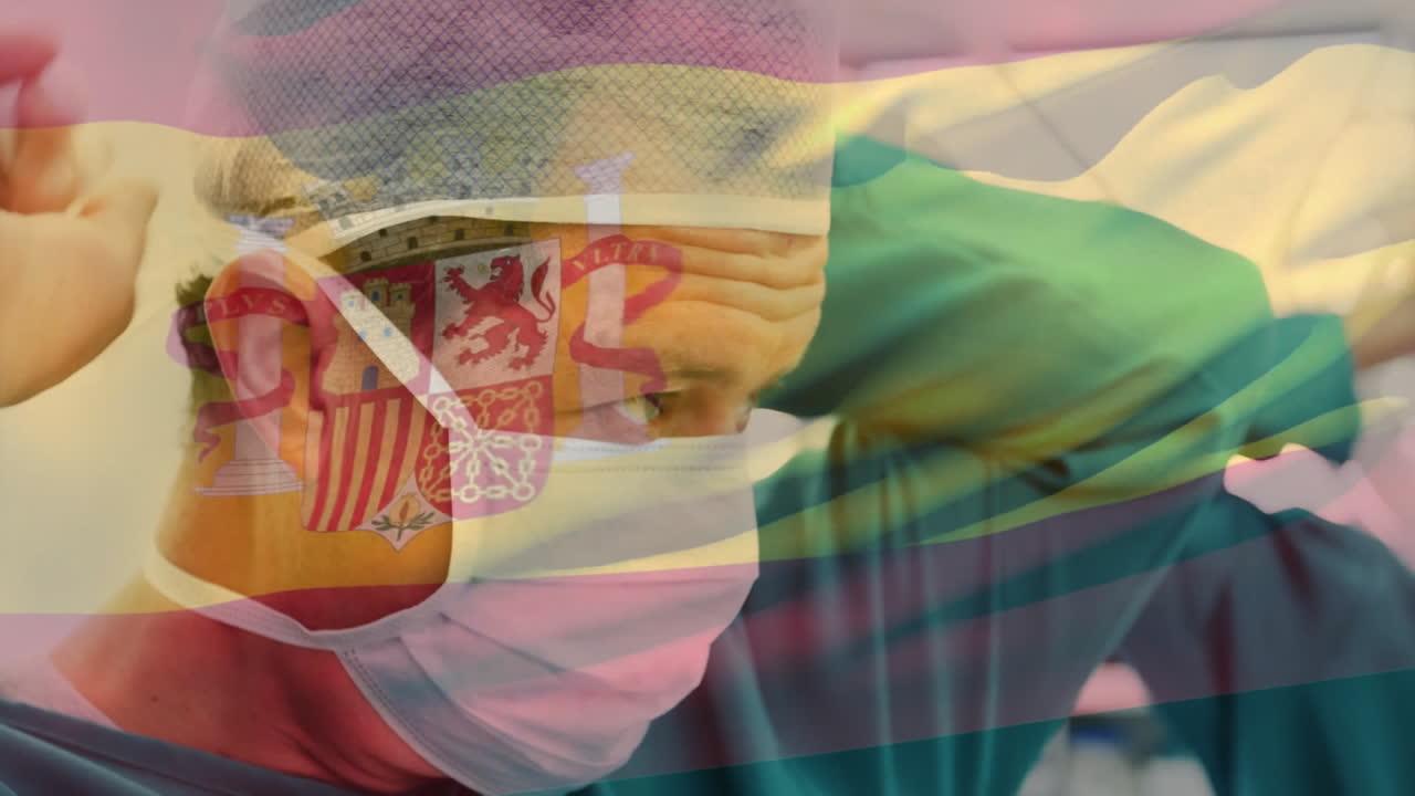 Animation of flag of spain over caucasian surgeons wearing face masks