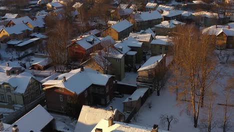 drone shot of snowy karlovas wooden houses