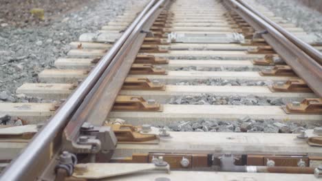 close-up view of railway tracks highlighting detailed structure and hardware