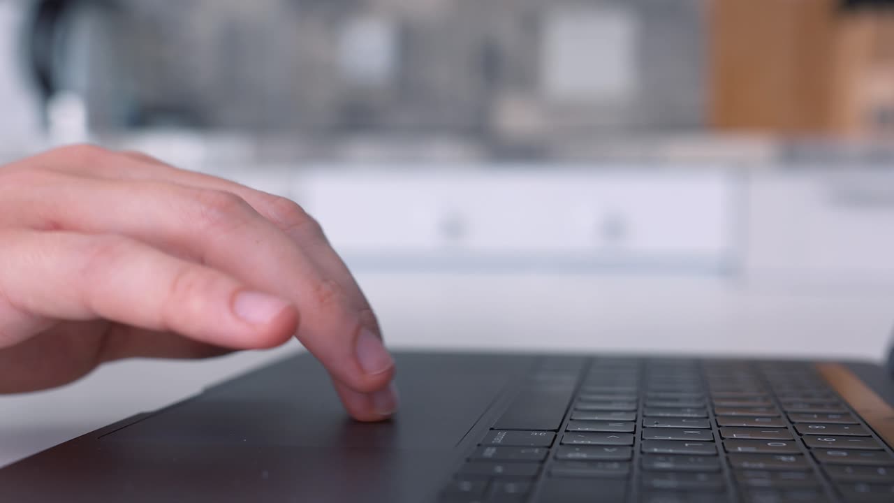 Person Typing on a Laptop